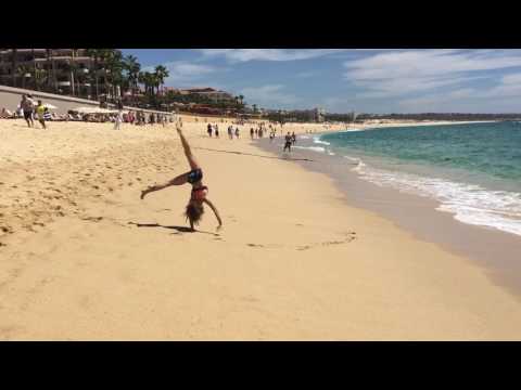 Trying to do a back tuck on the beach