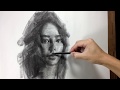 Drawing portrait in charcoal.