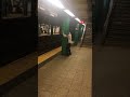 Subway Creatures Guy Hat Backwards Face Between Green Pillar Subway