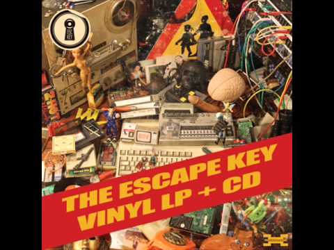 The Escape Key - Σε Έναν Κόσμο