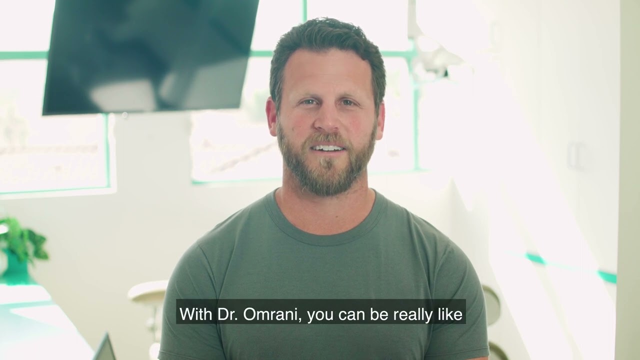 San Juan Capistrano dental patient wearing green shirt