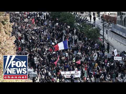 THOUSANDS gather in Paris as protests resume