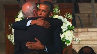Obama hugs, kisses Biden after eulogy