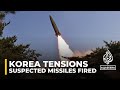 Korea tensions: North Korea fires suspected missiles into sea