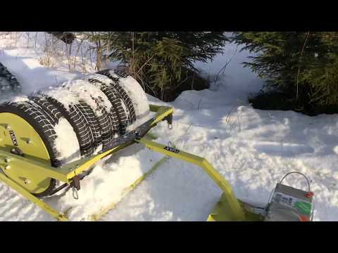 Ivak Compact track setter connected to Ivak 5-tyres SnowRoller in action