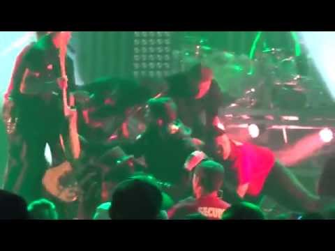 Motley Crue's , Nikki Sixx kicks Moron for jumping on stage and knocking over Mick Marrs.