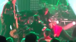 Motley Crue's , Nikki Sixx kicks Moron for jumping on stage and knocking over Mick Marrs.