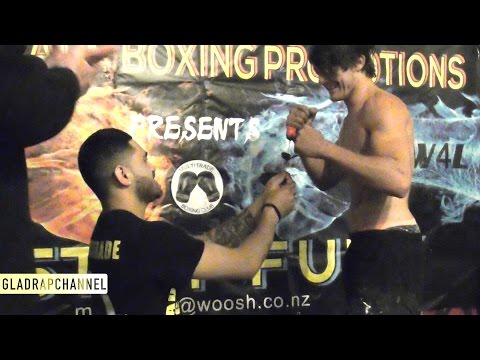 Fist of Fury III - Skope Siaosi offers Marcus Mackenzie a rose at Weigh In