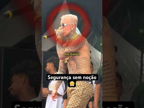 Mc Daniel fights with a security guard.