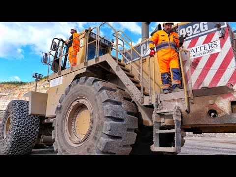 Caterpillar 992G Loading 777G Trucks