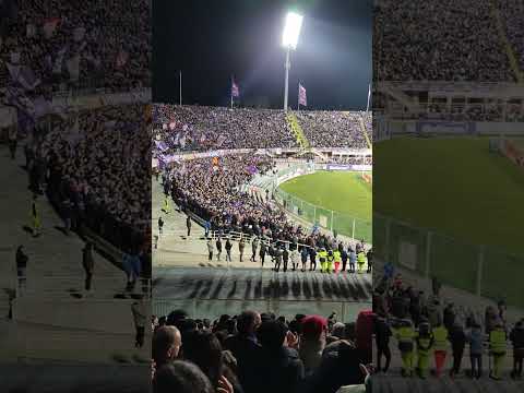 Fiorentina fans sing in tribute to Davide Astori in the 13th minute against Milan