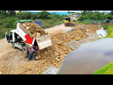 Best action heavy duty bulldozer in operation get mission on huge landfill in deep pond