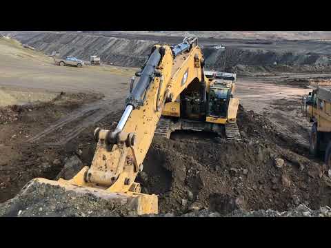 Caterpillar 385CL Excavator Loading Caterpillar 775E Dumpers And Trucks - Kivos Ate