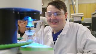 Two Chemistry students working in a lab