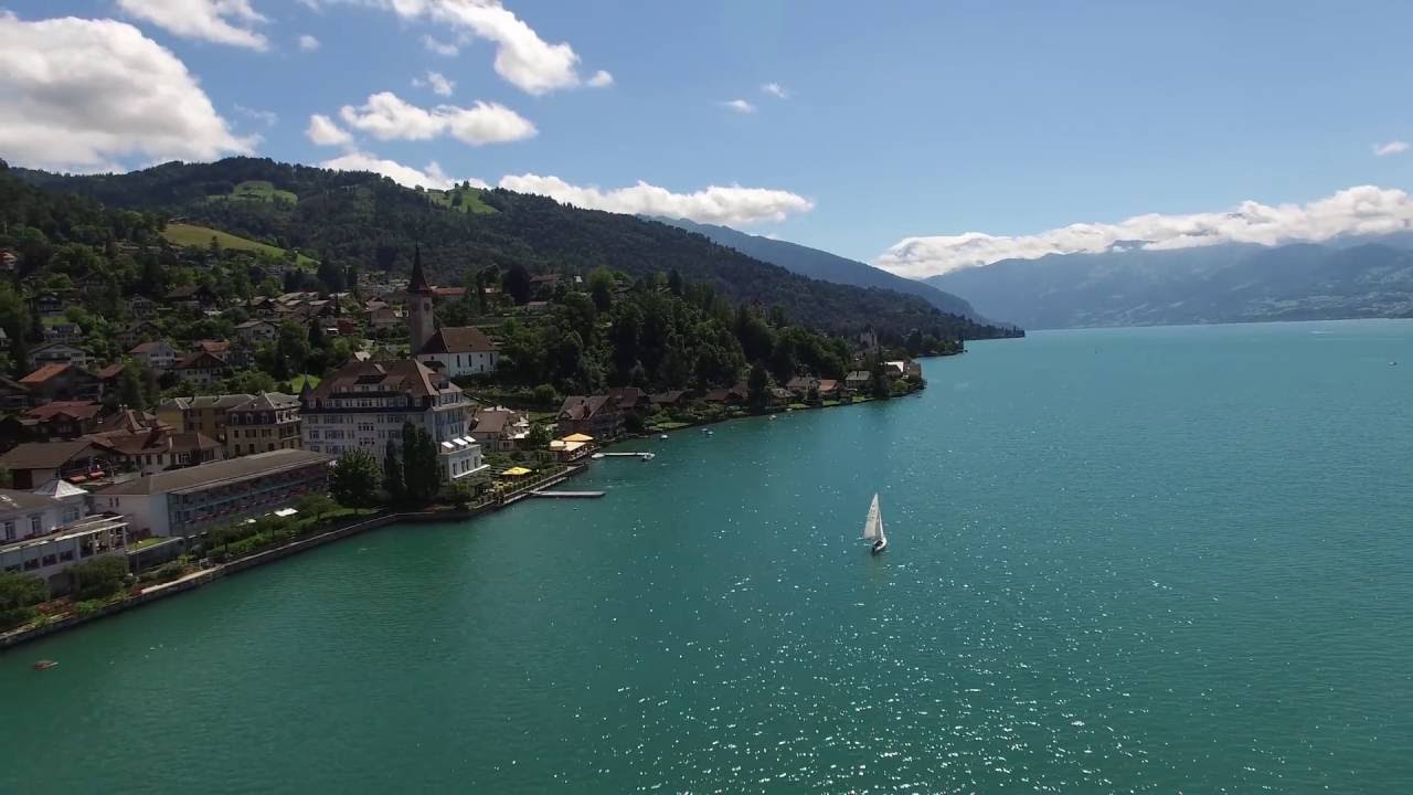Experience the breathtaking aerial view of serene Lake Thun.