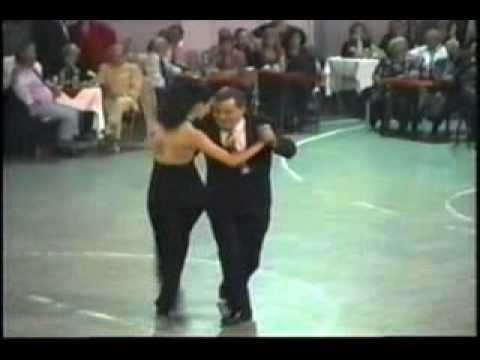  Puppy Castello  and  Luciana Valle  are  dancing  to  the  tango  "  Gallo Ciego  "