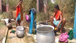 How do village women wash clothes