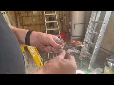 Wiring single LSF cables through a galvanised conduit.