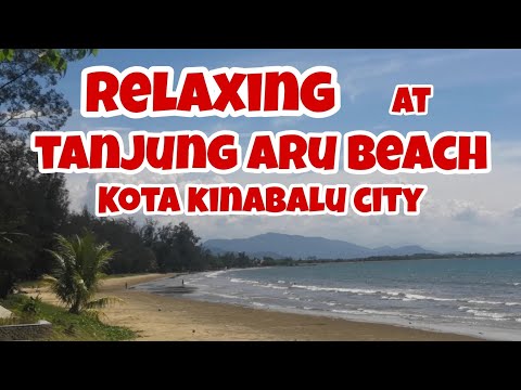 Relaxing at Tanjung Aru Beach, Kota Kinabalu City, Sabah, Malaysia