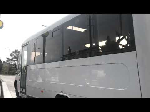 East Renfrewshire school bus passing Eaglesham Shops