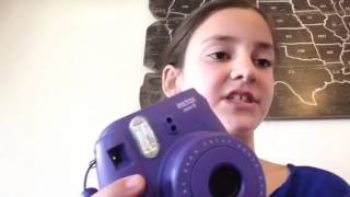 Alex explains how to use her Polaroid camera