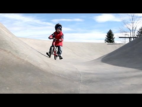 A 3 year old and his Strider bike in the skate park (Strider bikes rule!)
