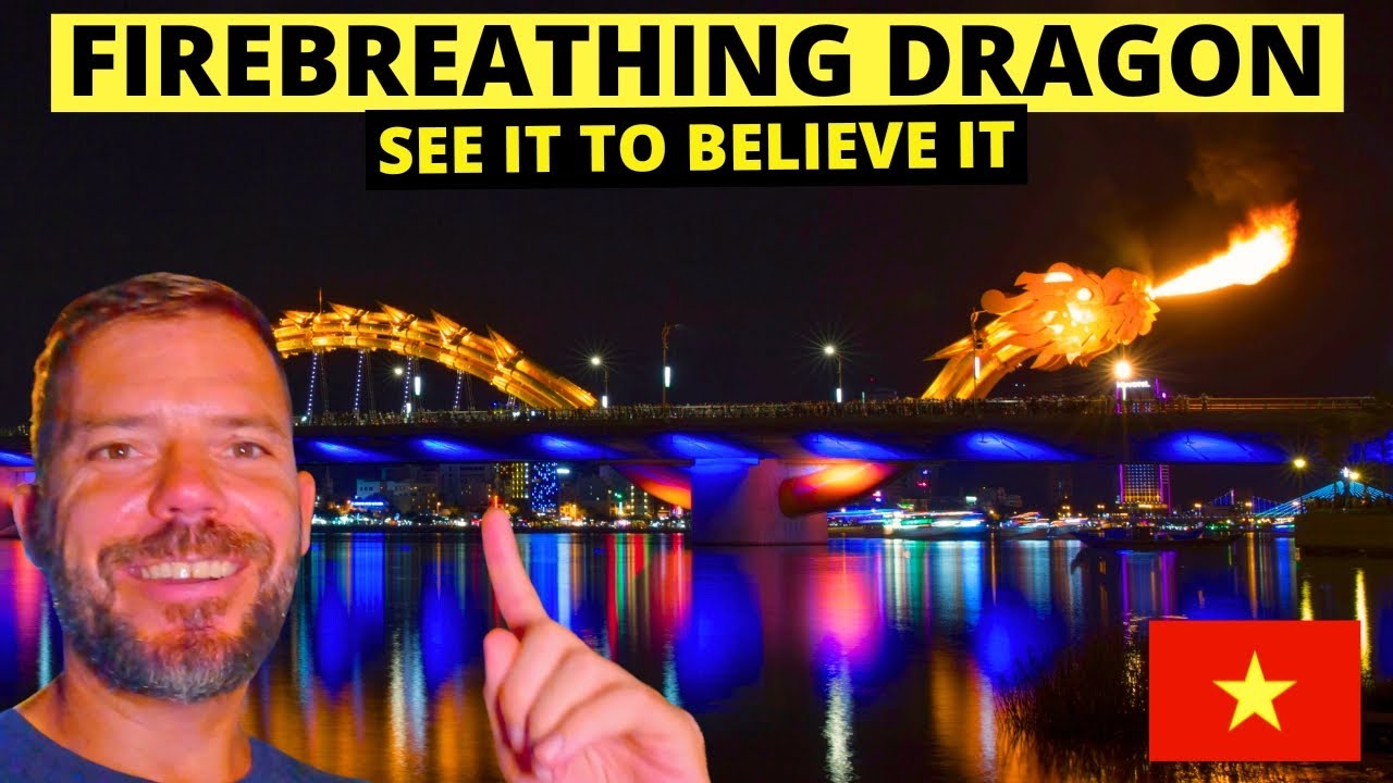 A tourist marvels at the exhilarating fire and water show at Dragon Bridge.