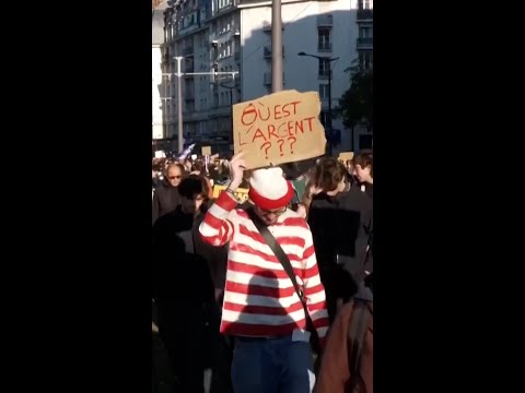 Parisians protest in Halloween costumes