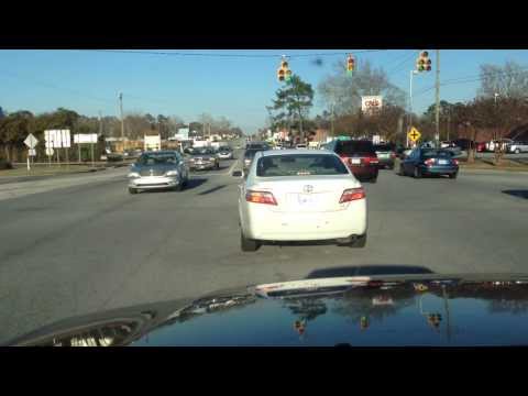 How to turn left at an intersection when there is oncoming traffic and no green arrow.