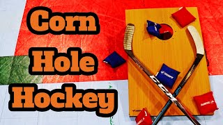 Playing Corn Hole but With Hockey Sticks