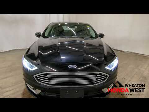 2017 Ford Fusion 4dr Sdn Titanium AWD in Black for sale at Wheaton Honda West in Calgary, AB