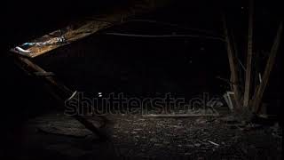 Sun's rays on a dark attic. Timelapse