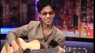 Prince playing acoustic guitar