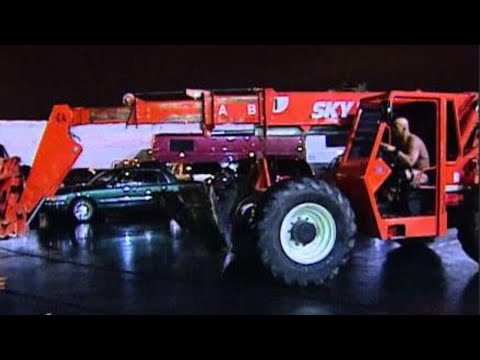 "Stone Cold" Steve Austin traps Triple H in his car and drops him with a forklift: Survivor Series