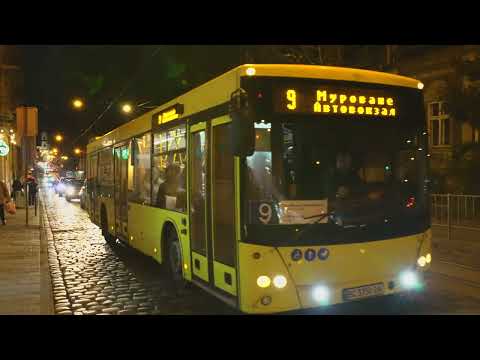Ukraine, Lviv, Київська (488) tram + bus stop @ night