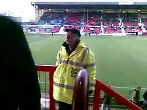 Foreign football steward dancing
