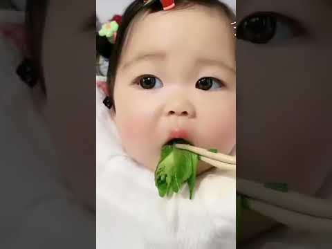 cute baby eating vegetables
