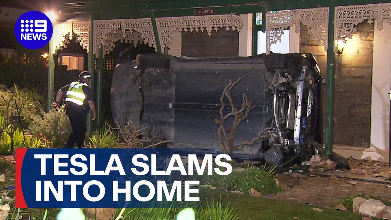 Three hospitalised after Tesla flips dramatically into home | 9 News Australia