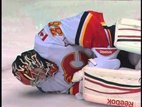 Flames goalie Henrik Karlsson hit in knee on collision