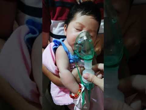 Nebulizing newborn baby