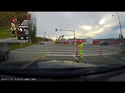 Clueless Driver Ignores Flagger, Flagger Deals With It Professionally