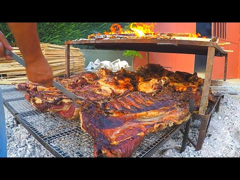 Italian Street Food Festival of Bull Meat. Huge Blocks of Meat on Grill