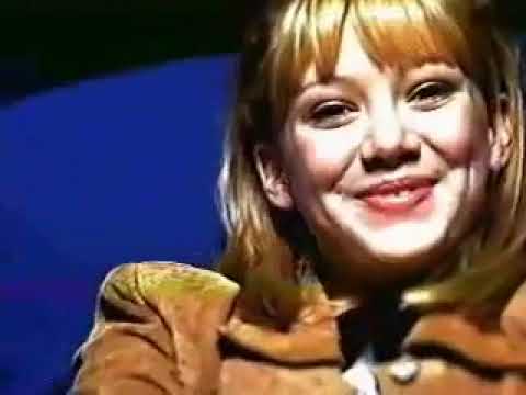 Lizzie McGuire TV trailer frame: animated Lizzie pops beside Hilary Duff in a fast-cut Disney Channel promo