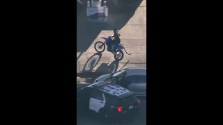 Dirt bike rider stops for gas during police chase