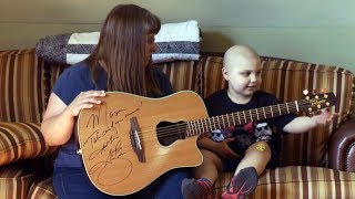 Garth Brooks stops concert to gift guitar to cancer survivor