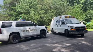 Coroner trucks leave Coweta County home after 4 killed in suspected murder-suicide