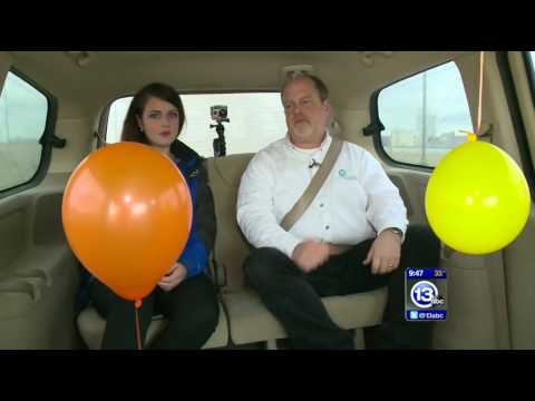 Floating helium balloon in a moving car