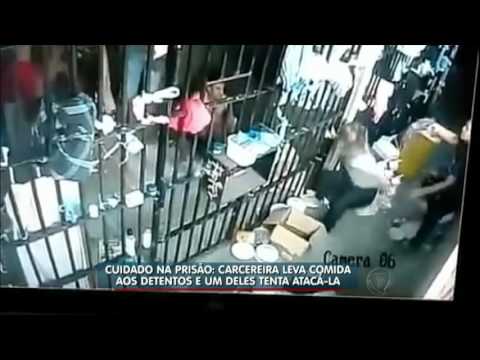 A prison guard brings food to the inmates, and one of them has an unexpected reaction.