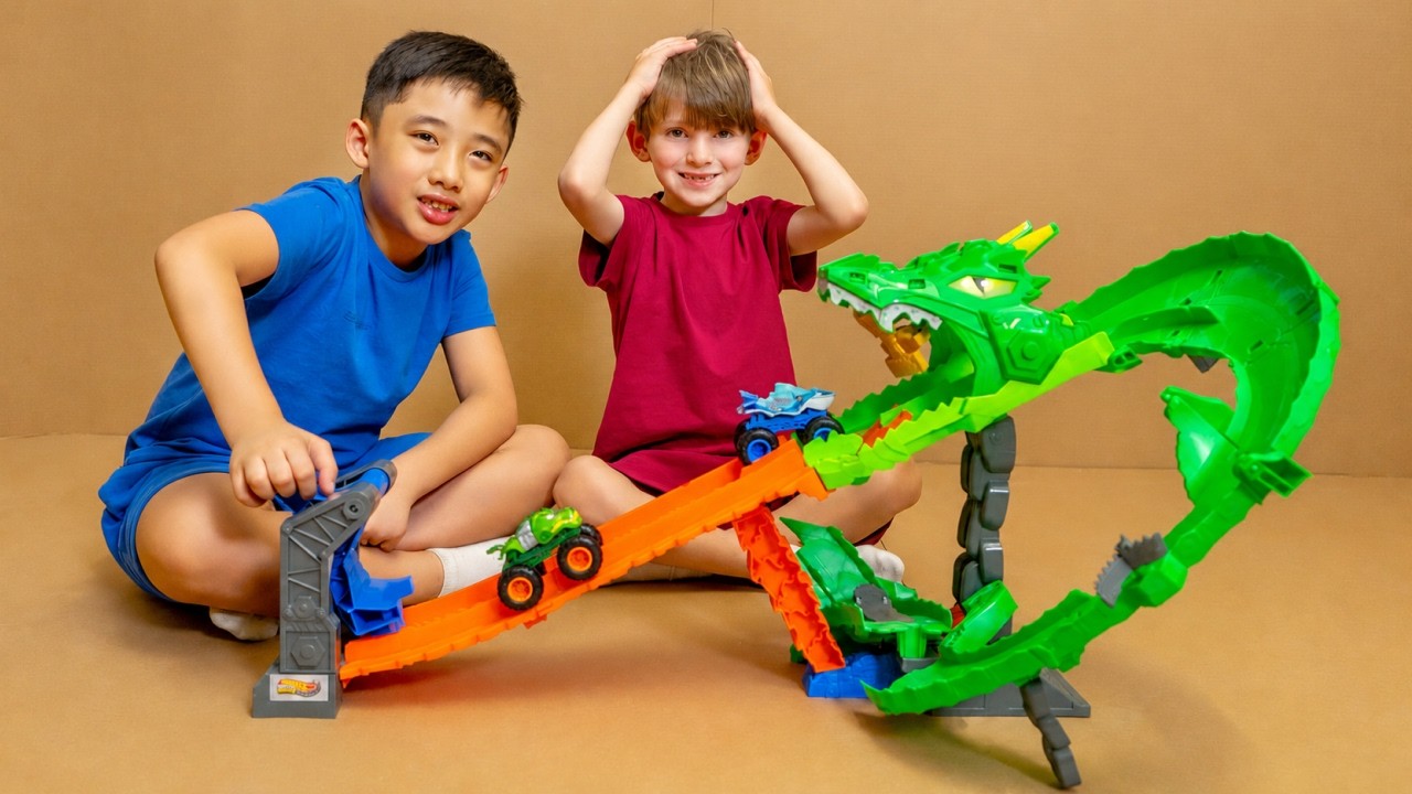 Kids Play with Monster Trucks in a Cardboard Maze