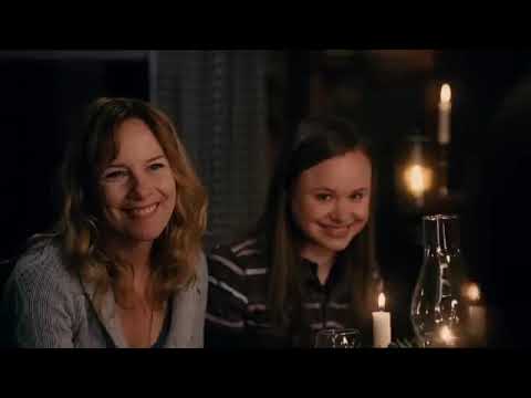 Close-up trailer frame of Dan and Marie where a soft guitar cue typically underlines the scene